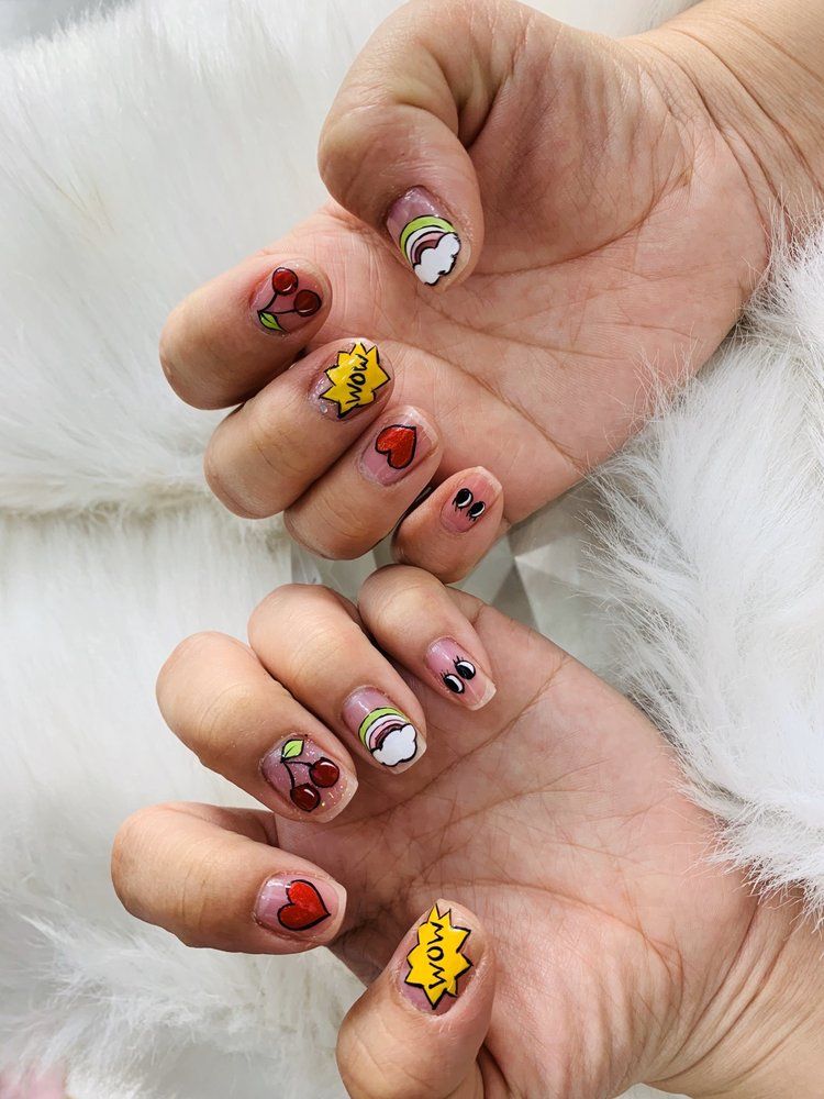 Short nails with hand-painted cherries, hearts and pop-art designs