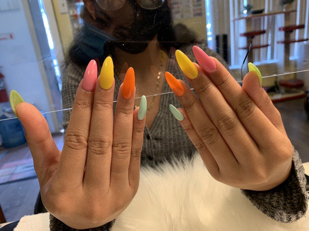 Long almond nails in sorbet shades of pink, yellow, orange and mint