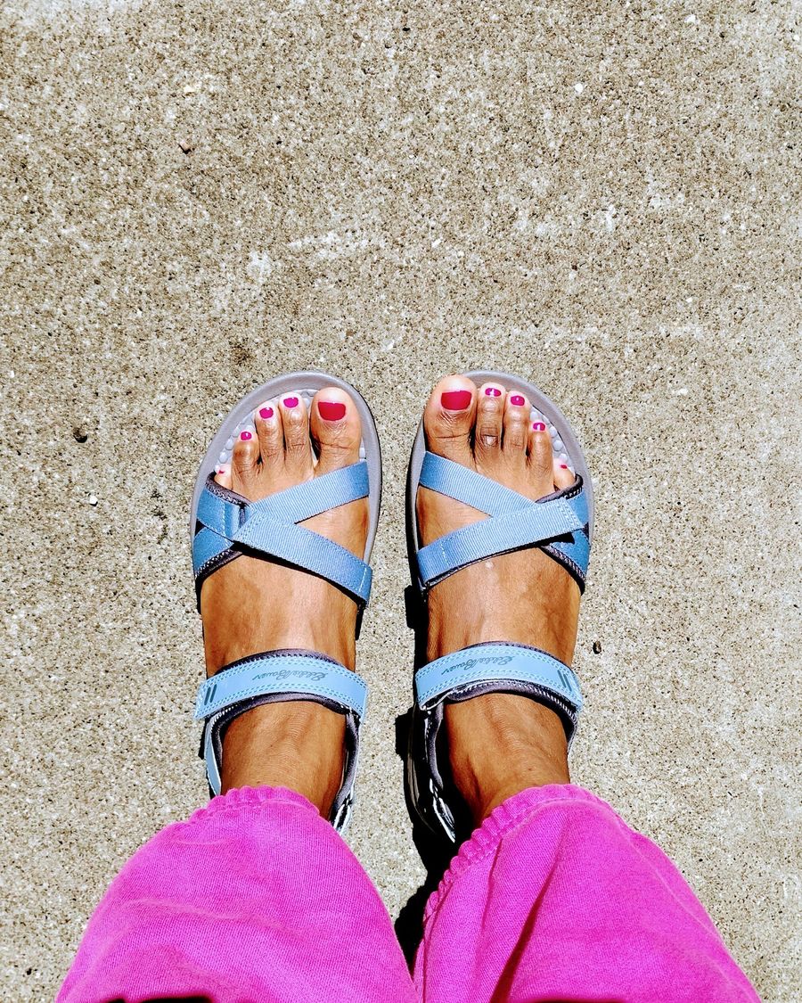 A fresh pink pedicure in blue sandals